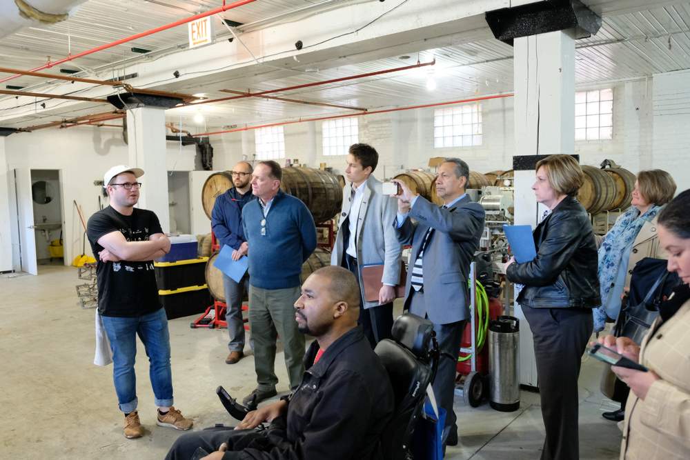 Marz Brewing Taproom Manager Joseph Guzzo leads the tour of the brewery's production area.