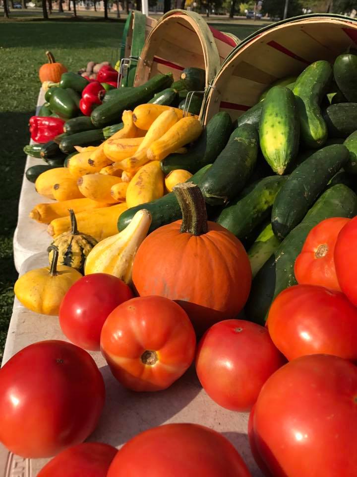 A market stand displays fresh produce at the 2017 McKinley Park Farmers Market.