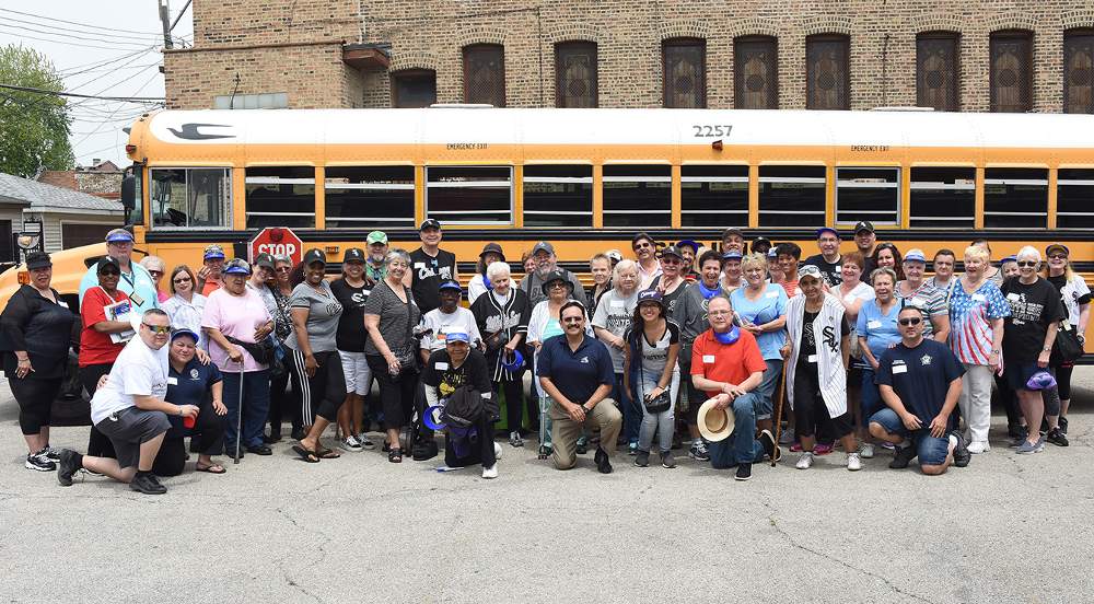 Illinois 1st District State Senator Antonio "Tony" Muñoz and his senior baseball outing guests get ready to board the bus for the White Sox game on June 14.