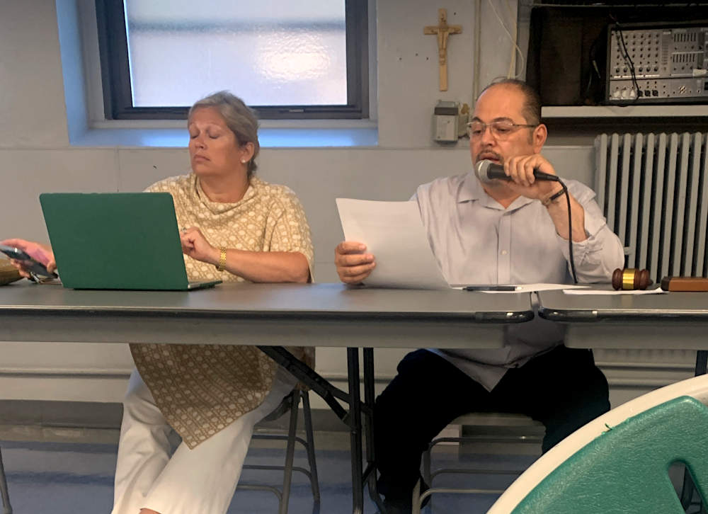 Denise McBroom and Carlos Sanchez preside over the 9th District Police Council meeting on August 30, 2023.