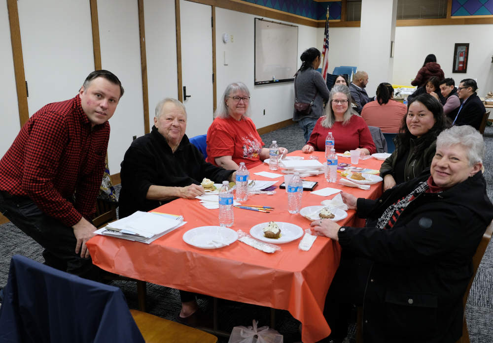 McKinley Park Civic Association officers, members and friends enjoy a Valentine's Day party at the McKinley Park library during the assocation meeting on Wednesday, February 7, 2024.