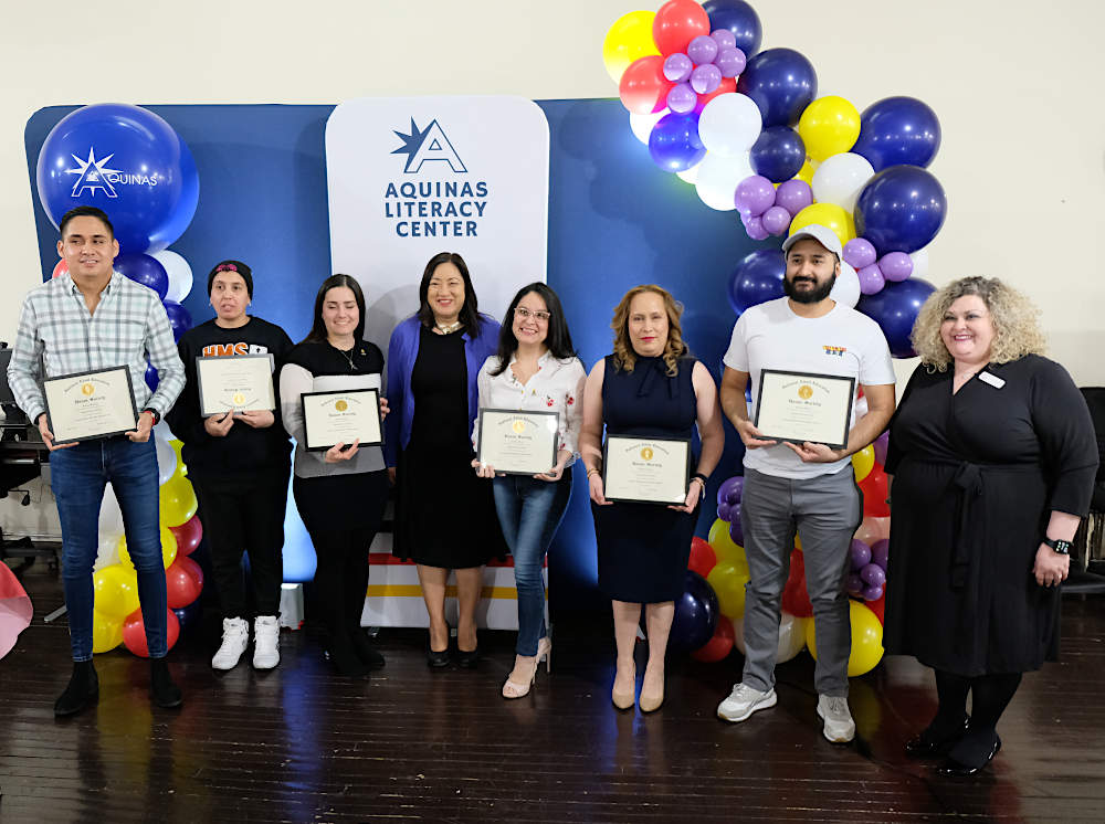 Students, staff and supporters celebrate accomplishments at Aquinas Literacy Center on February 26, 2024, at an induction ceremony for the National Adult Education Honor Society.