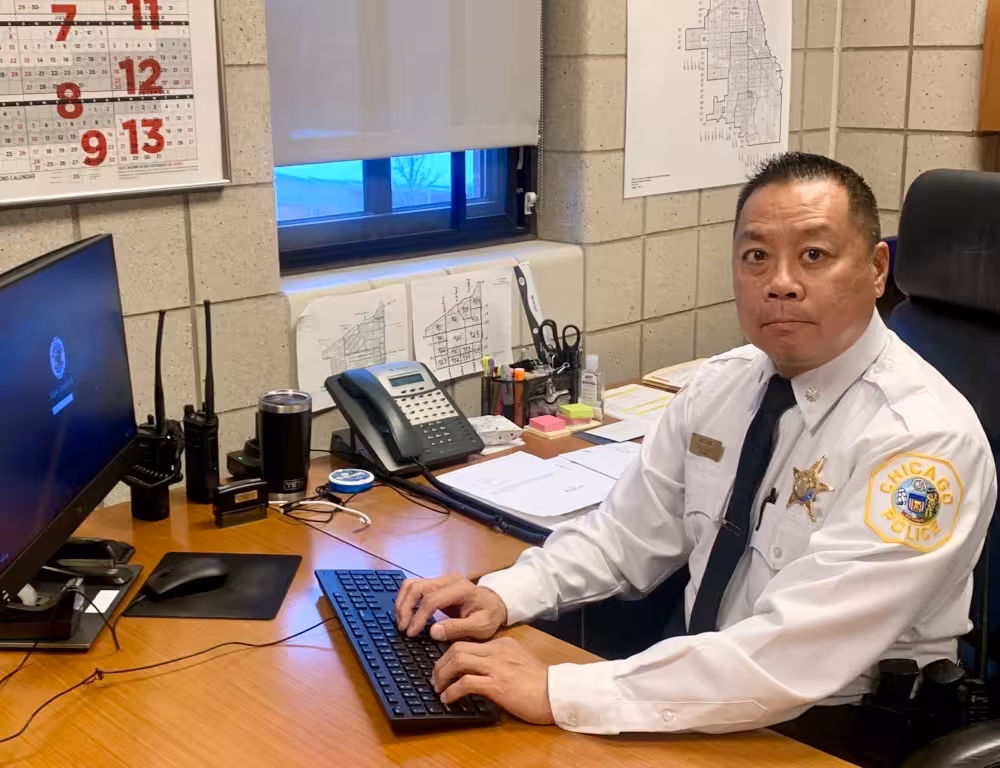 Chicago Police Department Commander Joseph Mark prepares for work at his 9th District office.