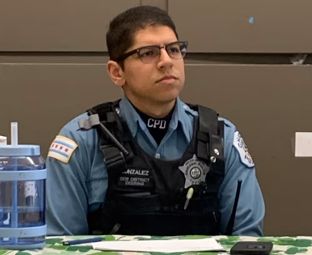 Chicago Police Department 9th District Community Policing Officer Christopher Gonzalez attends the March 2025 meeting for Beat 912 at the McKinley Park field house.