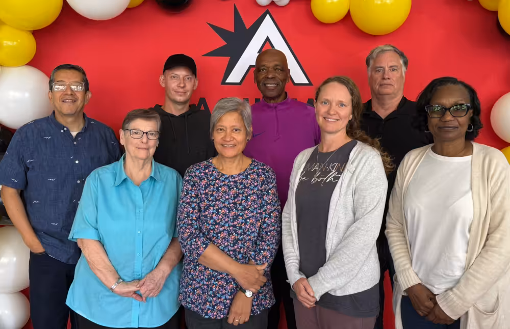 From left to right, Enrique Nieto, Lynn Nelson, Tom Dankers, Terri Quinones, Lester Wright, Jessi Beck, Dan Reynolds and Tamara Earley celebrate their graduation through the Aquinas Literacy Center tutor training program.