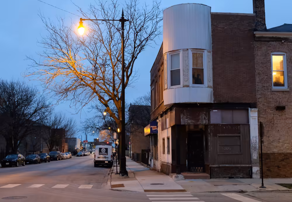 The sun rises on vacant storefronts on West 35th Street in Chicago's McKinley Park neighborhood.